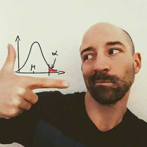 Dominik Liebl pointing at a normal density and its upper tail